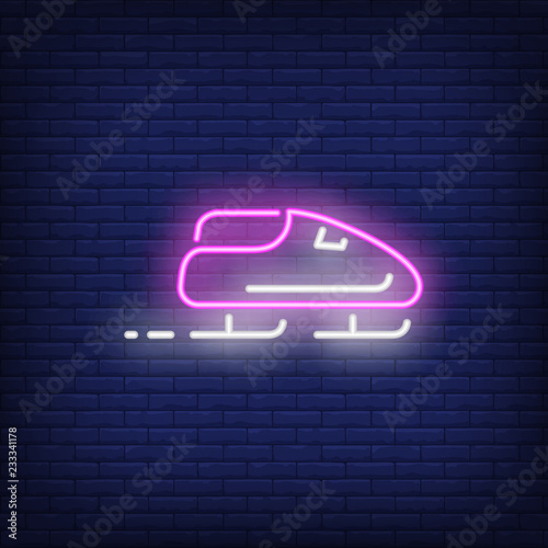 Purple bobsleigh neon sign. Glowing bob with sport team on dark blue brick background. Can be used for sport, winter games, Olympic