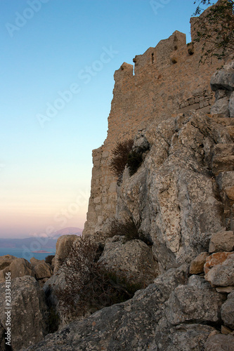 Halki - Castle ruines at sundown located at the peak of the hill. Dodecanese Islands, Greece   © tella0303