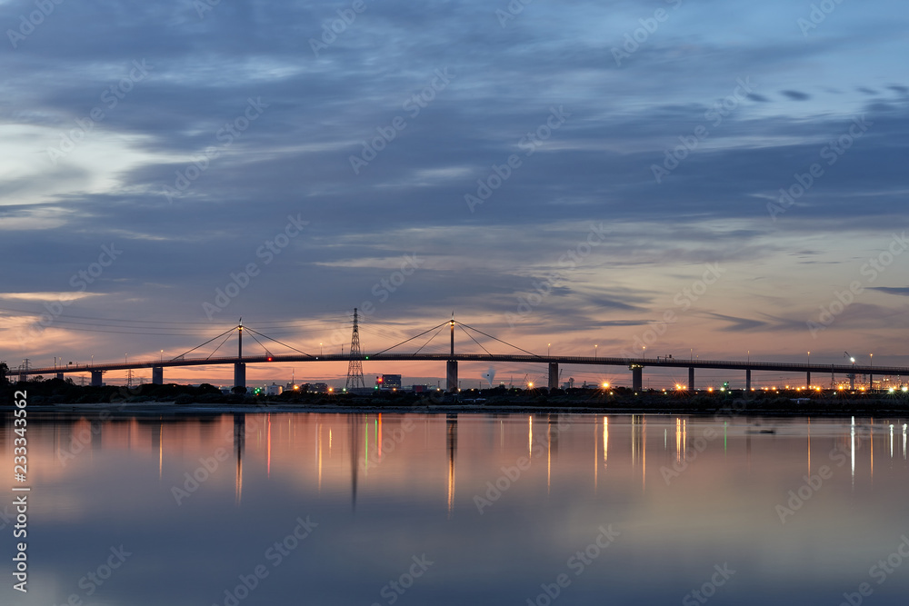 Westgate Bridge at sunset over the Yarra River in Melbourne, Australia.