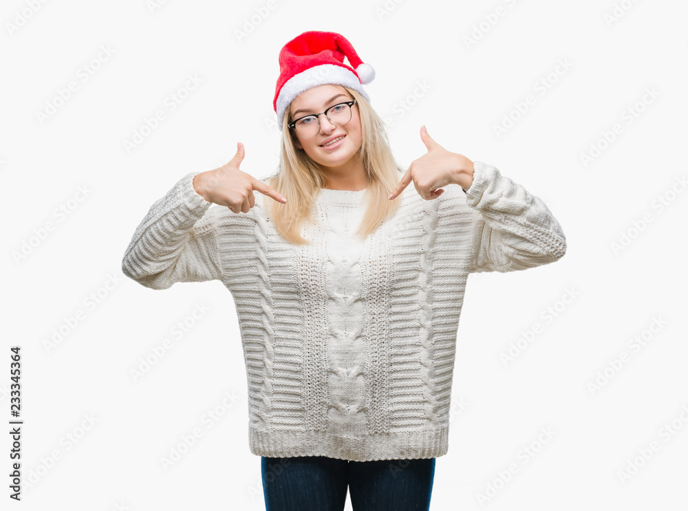 Young caucasian woman wearing christmas hat over isolated background looking confident with smile on face, pointing oneself with fingers proud and happy. Young caucasian woman wearing christmas hat over isolated background looking confident with smile on face, pointing oneself with fingers proud and happy.