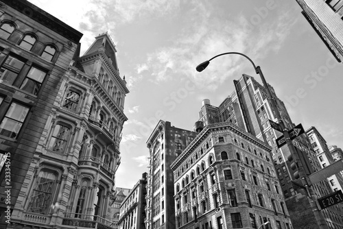 New York USA buildings, modern and old architecture, street, colorful facade and blue cloudy sky in manhattan midtown in new york © poludziber