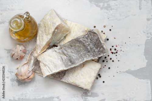 dry cod fish on white ceramic background