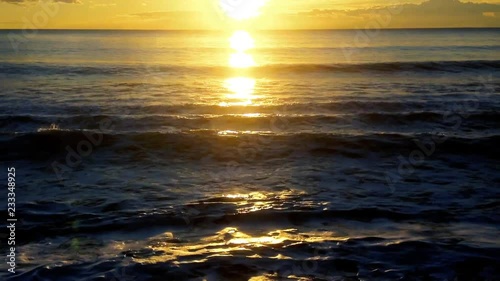 Ssea waves with sunset light in a summer day. photo