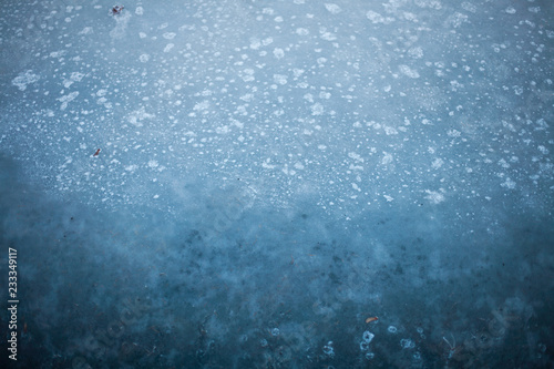 Abstract background of textures in frozen icy azure blue water