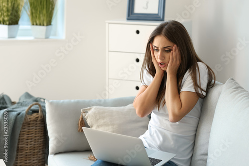 Emotional young woman after...
