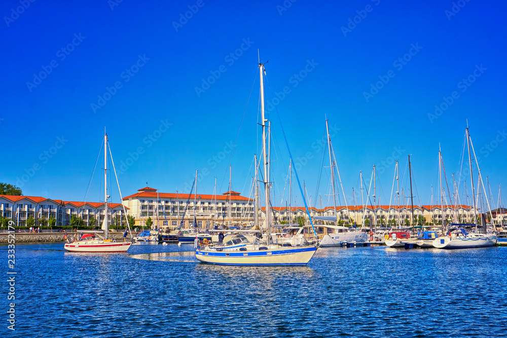Holiday resort with sailboats in the harbor Weiße Wiek.