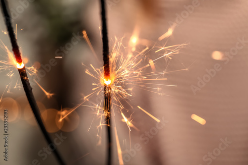 Christmas sparklers on blurred background  closeup