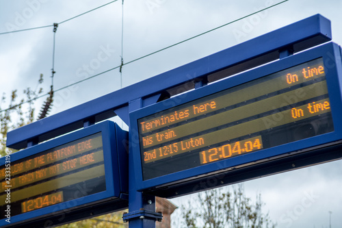 Arrivals and departures information sign at the train station photo