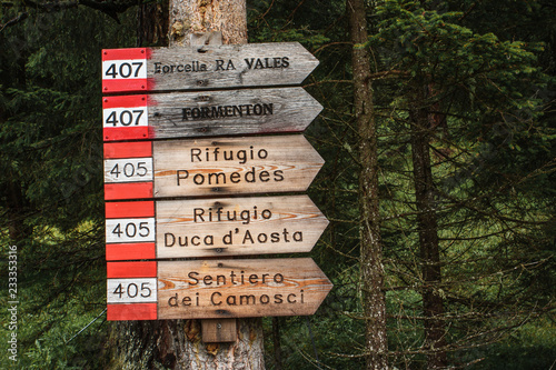 Sign for the lodges on the trail of the Tofane range, Cortina d'Ampezzo, Dolomites, Italy. photo