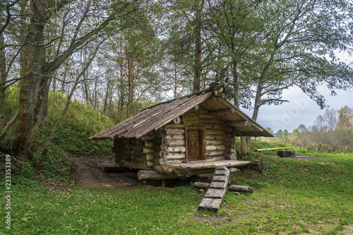 A small wooden hut in the park of the village Kukoboy, Russia.