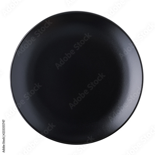 Empty ceramic plate of black color, top view of an isolated object