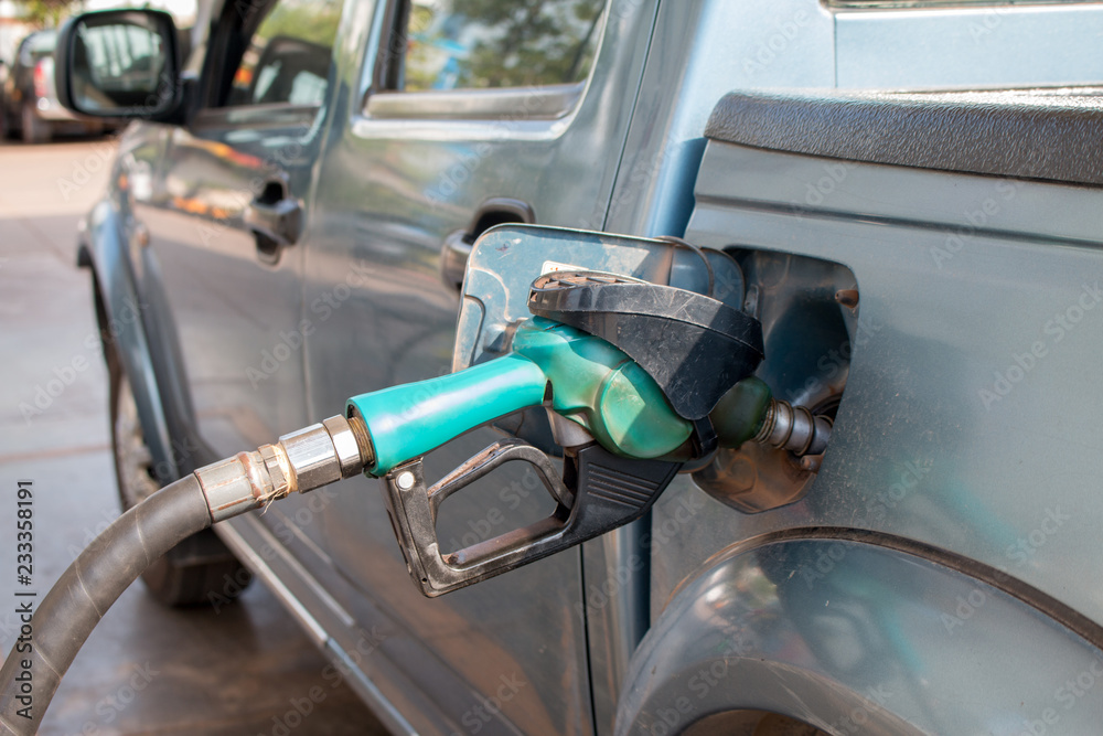 Hand Pumping Gas Into Car Hand Pumping Gas Into Car