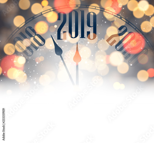 Blurred New Year 2019 card with clock and lights.