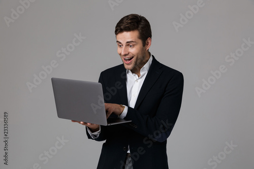 Portrait of a delighted young businessman