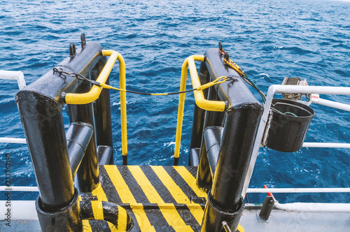 View of offshore vessel boatlanding - installation for crew change. Safe work at sea photo