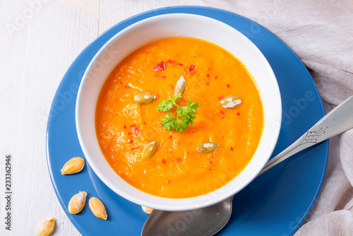 healthy pumpkin soup with ginger carrots and coconut milk photo