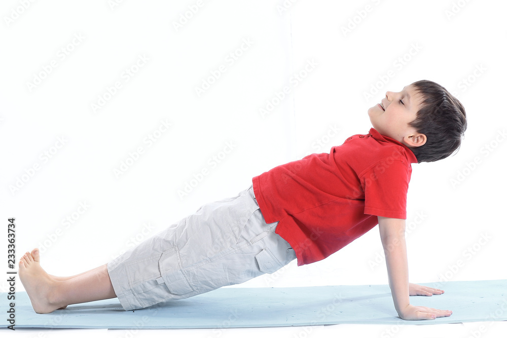 little boy performs morning health gymnastics.isolated on white little boy performs morning health gymnastics.isolated on white