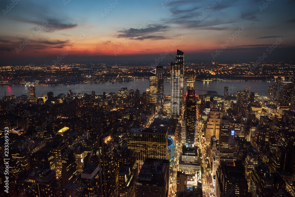 View of the night city and glowing skyscrapers from a height at sunset  New York. USA
