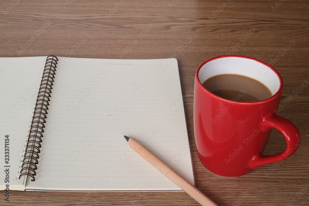 A cup of coffee on working table. A cup of coffee on working table.