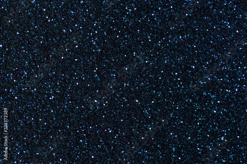 Navy blue sparkling background from small sequins  closeup. Brilliant backdrop.