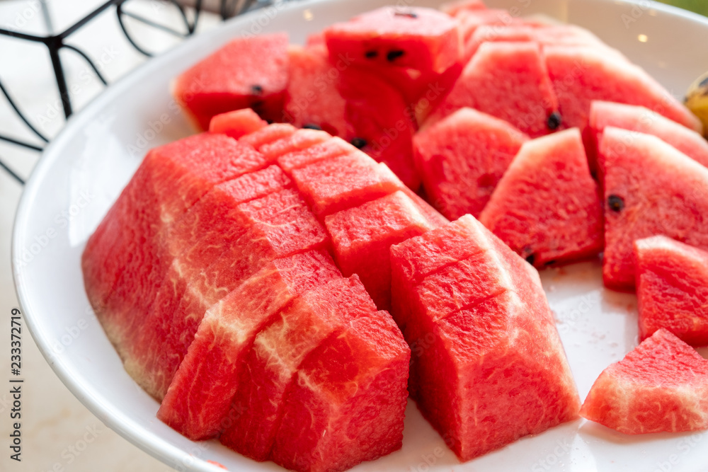 Red fruit watermelon slices on plate in morning Red fruit watermelon slices on plate in morning