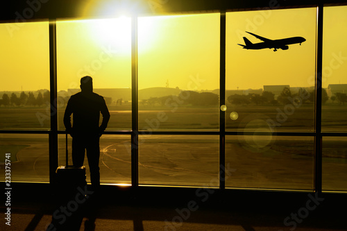 The silhouette of the traveler at the airport.