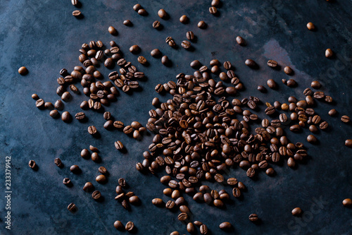 Freshly roasted coffee beans on dark background