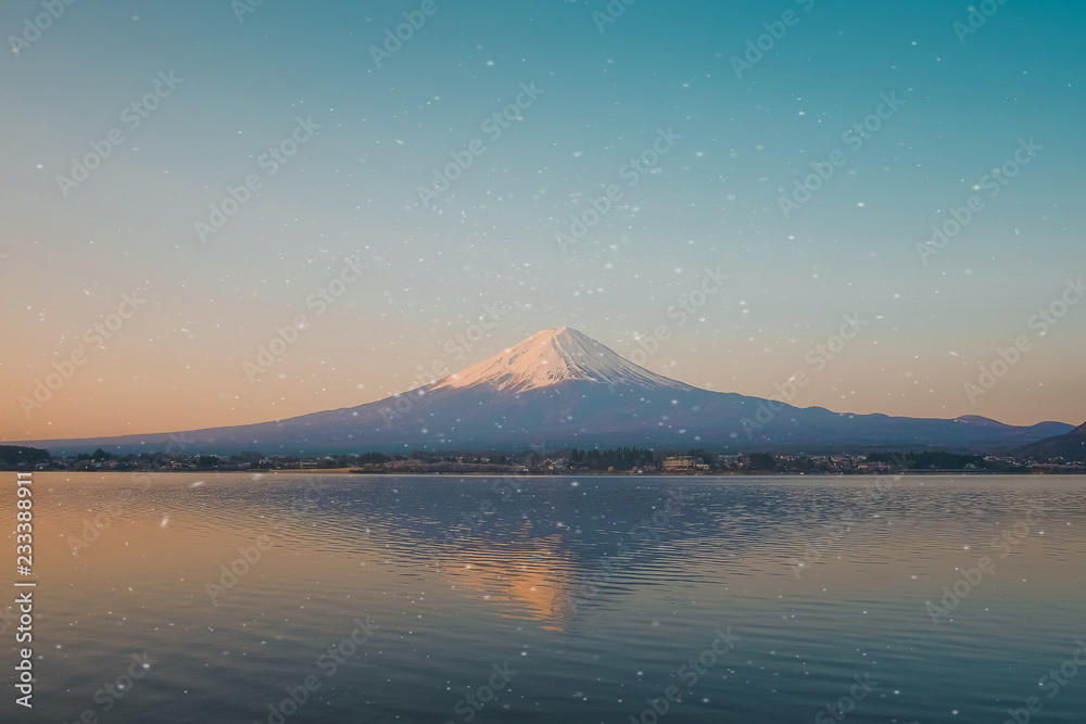 Reflection of Fuji mountain with snow capped in the morning Sunrise at Lake kawaguchiko, Yamanashi, Japan. landmark and popular for tourist attractions