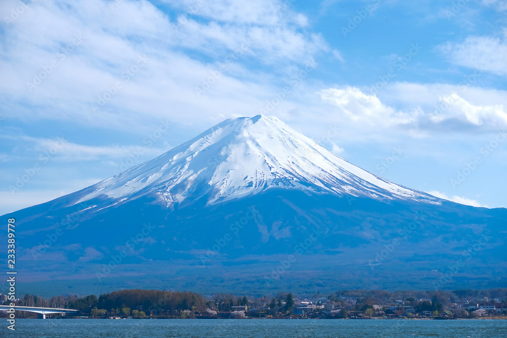 Beautiful Mount Fuji with snow capped and blue sky at Lake kawaguchiko, Japan. landmark and popular for tourist attractions Beautiful Mount Fuji with snow capped and blue sky at Lake kawaguchiko, Japan. landmark and popular for tourist attractions