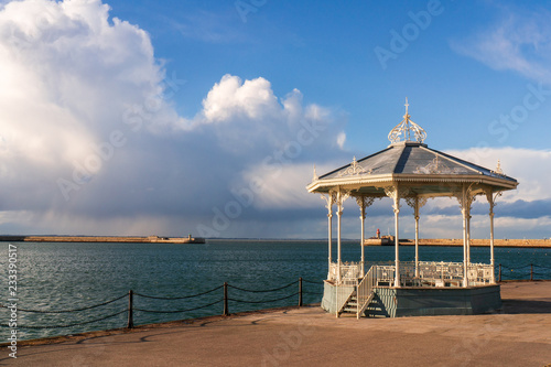 The Dun Laoghaire bandstand landmark located on the East pier of the harbour in Dublin, Ireland. Victorian cast iron filigree bandstand. photo
