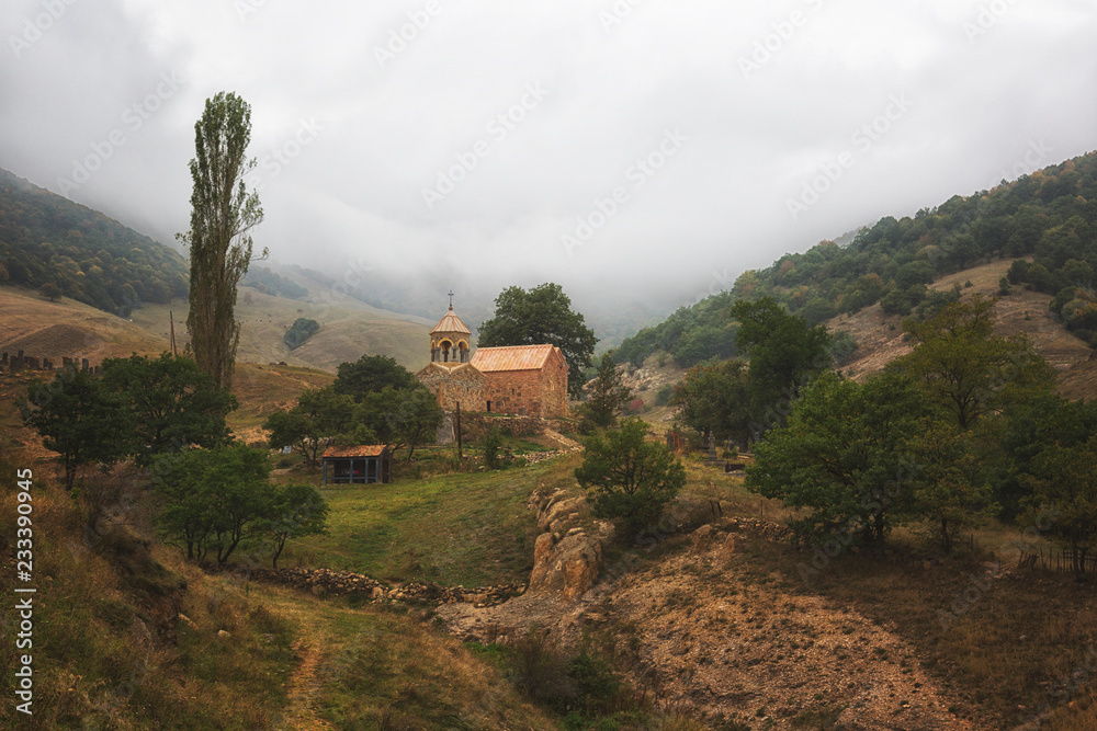 Old church in Armenia in cloudy weather