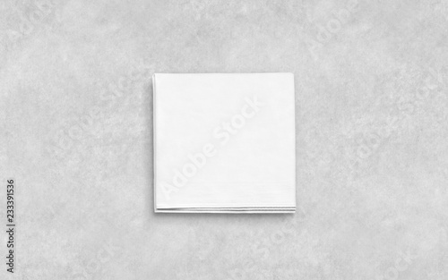 Blank white folded napkin on textured surface mockup