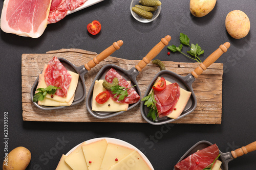 Canvas Print raclette cheese with salami