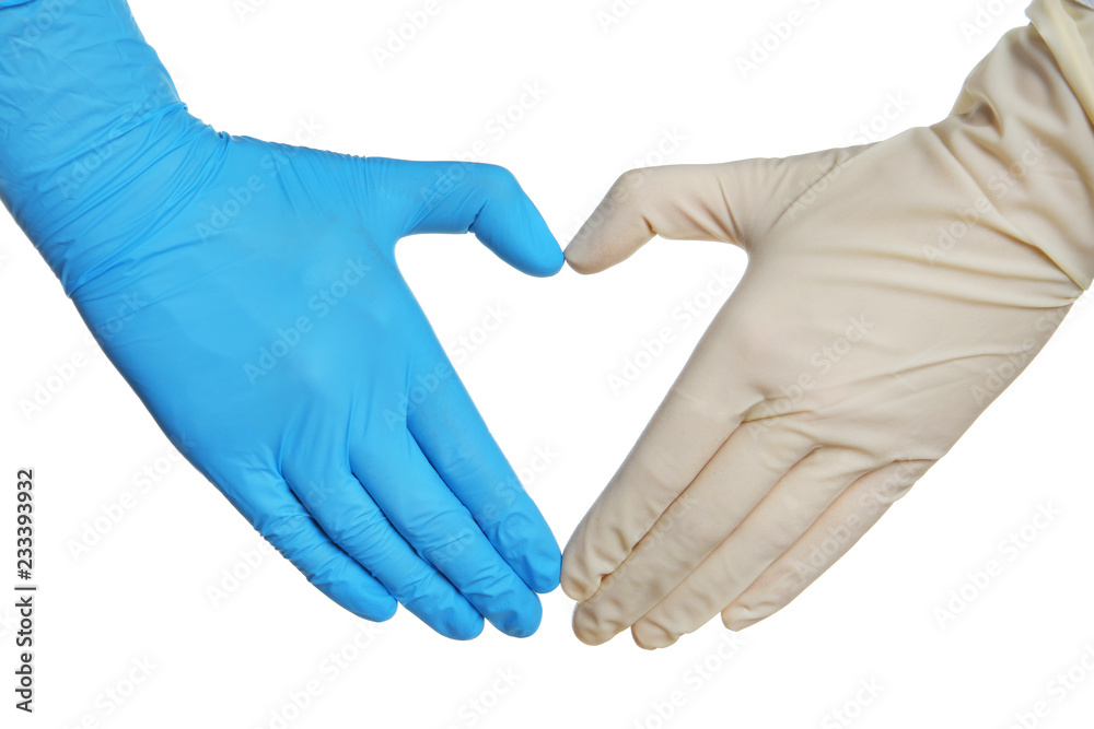 Doctor making heart shape with hands in different medical gloves on white background Doctor making heart shape with hands in different medical gloves on white background