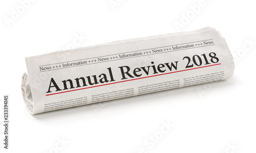 Rolled newspaper with the headline Annual review 2018