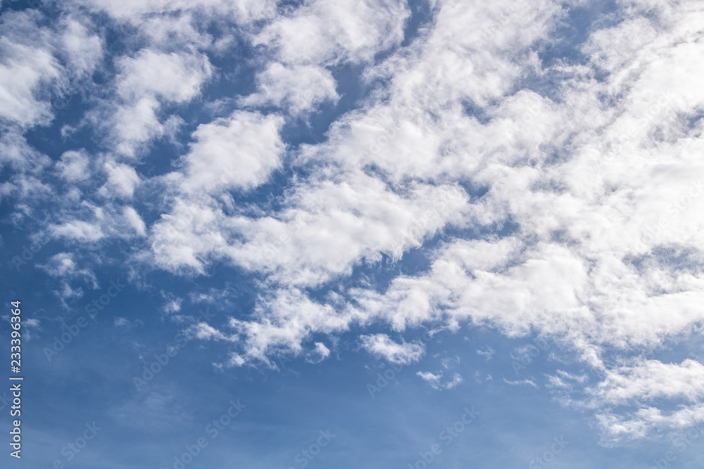 clear blue sky white clouds and bright light