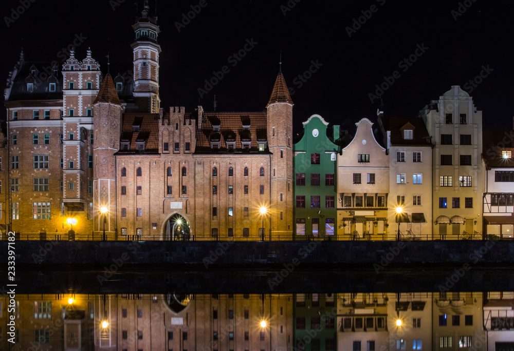 Ancient houses on the promenade of Gdansk at night. Poland
