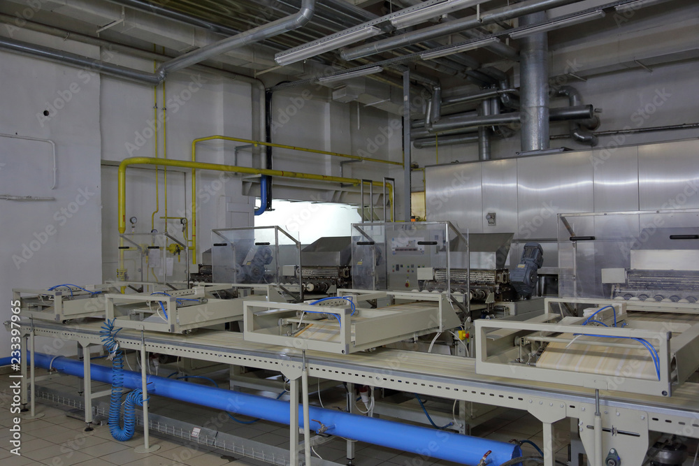 Industrial equipment and machinery at the factory of bread and sweets