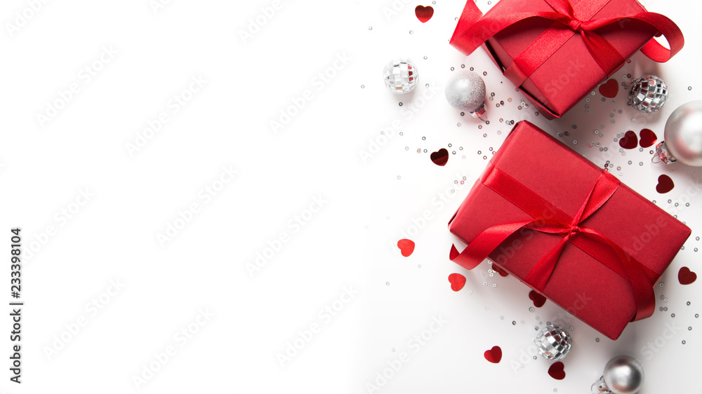 Merry Christmas and Happy Holidays greeting card. New Year. Red gift, present on white background top view. Winter holidays. - obrazy, fototapety, plakaty 