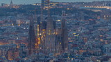 Sagrada Familia, a large church in Barcelona, Spain night to day timelapse