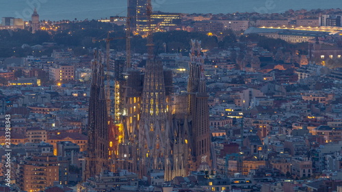 Sagrada Familia, a large church in Barcelona, Spain night to day timelapse