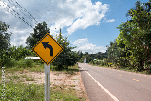 Road Signs warn Drivers for Ahead Dangerous Curve