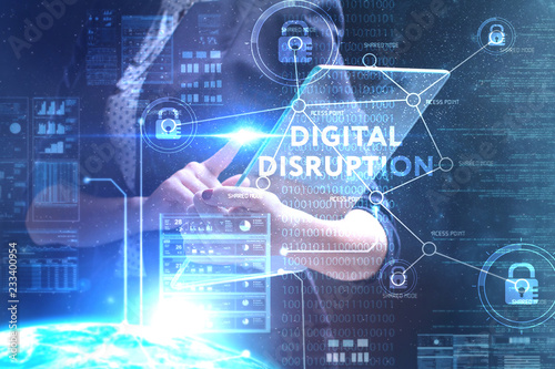The concept of business, technology, the Internet and the network. A young entrepreneur working on a virtual screen of the future and sees the inscription: digital disruption
