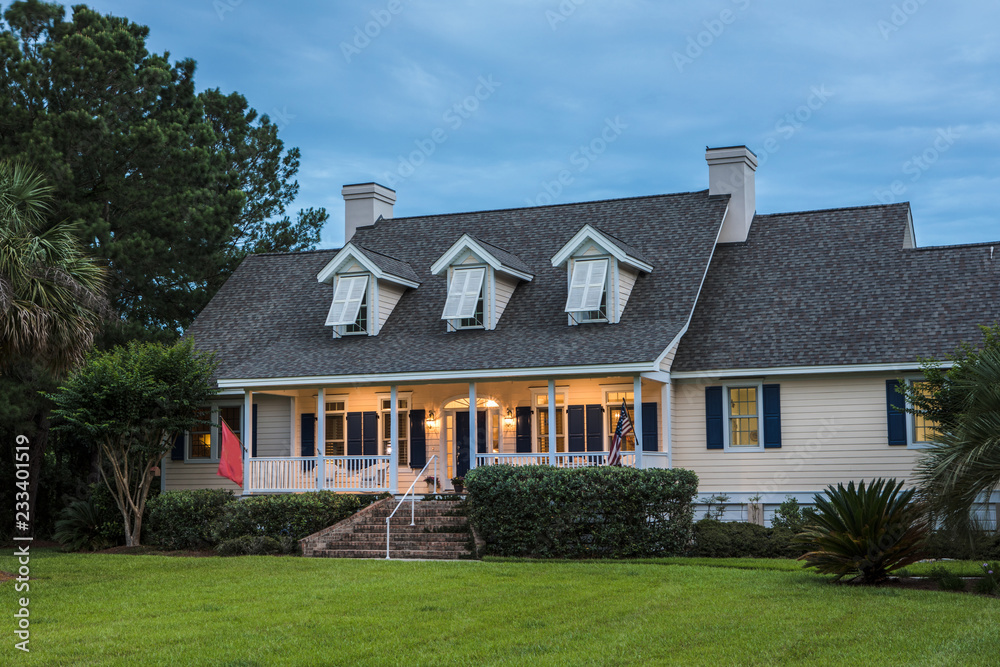 Beautiful home lit up at twilight.