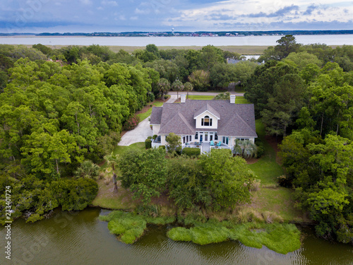 Фотография Aerial view of waterfront home on wooded property