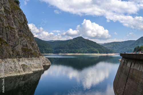 Vidraru Dam with water and forest background