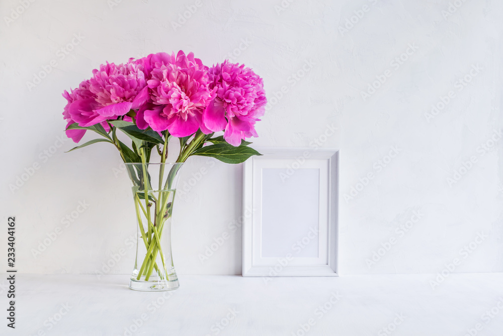 Mockup with a white frame and pink peonies Mockup with a white frame and pink peonies