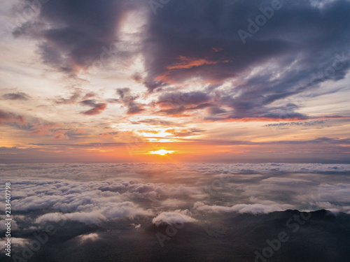 Beautiful Sunrise Sky with Sea of the mist of fog in the morning on Khao Luang mountain in Ramkhamhaeng National Park,Sukhothai province Thailand © Sumeth