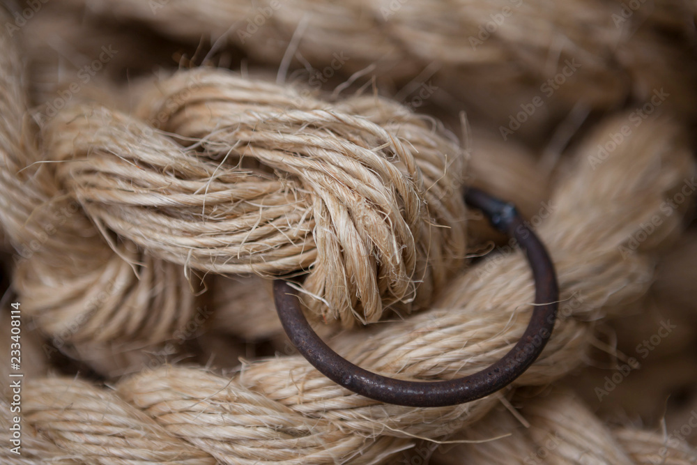 Coil of rope with a marine unit, and an iron ring. Coil of rope with a marine unit, and an iron ring.