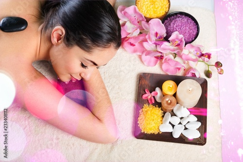 Young woman relaxing in spa salon